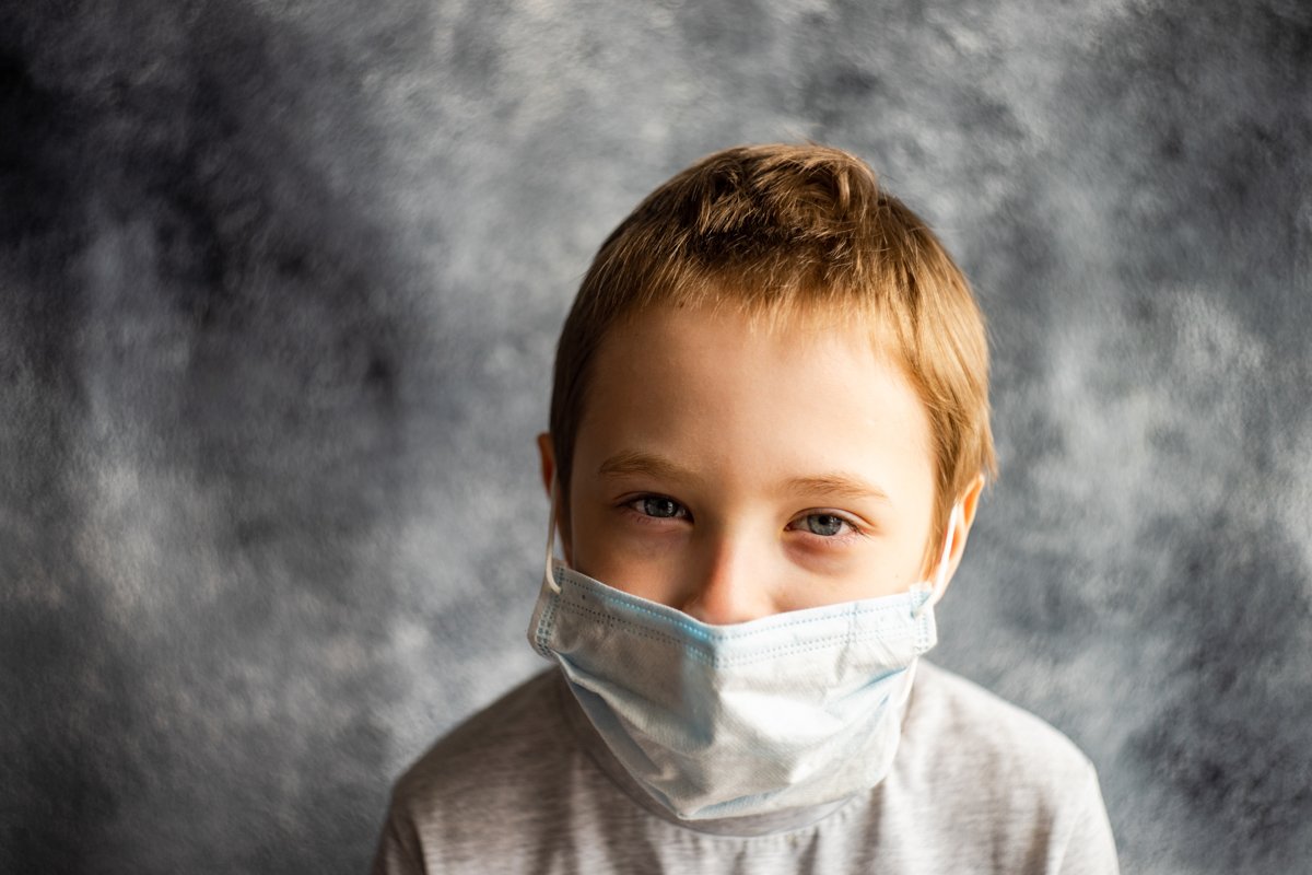 Cute boy in face mask example image 1