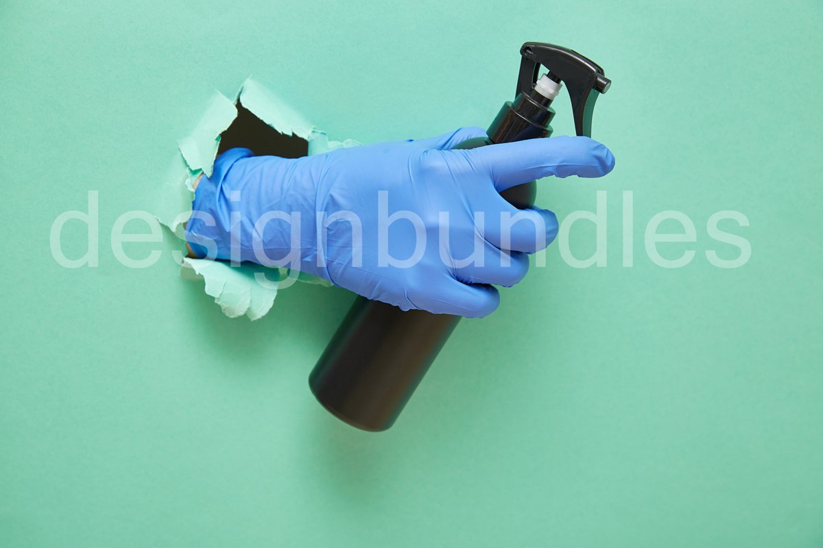 a gloved hand holds a disinfectant in a black spray bottle. example image 1