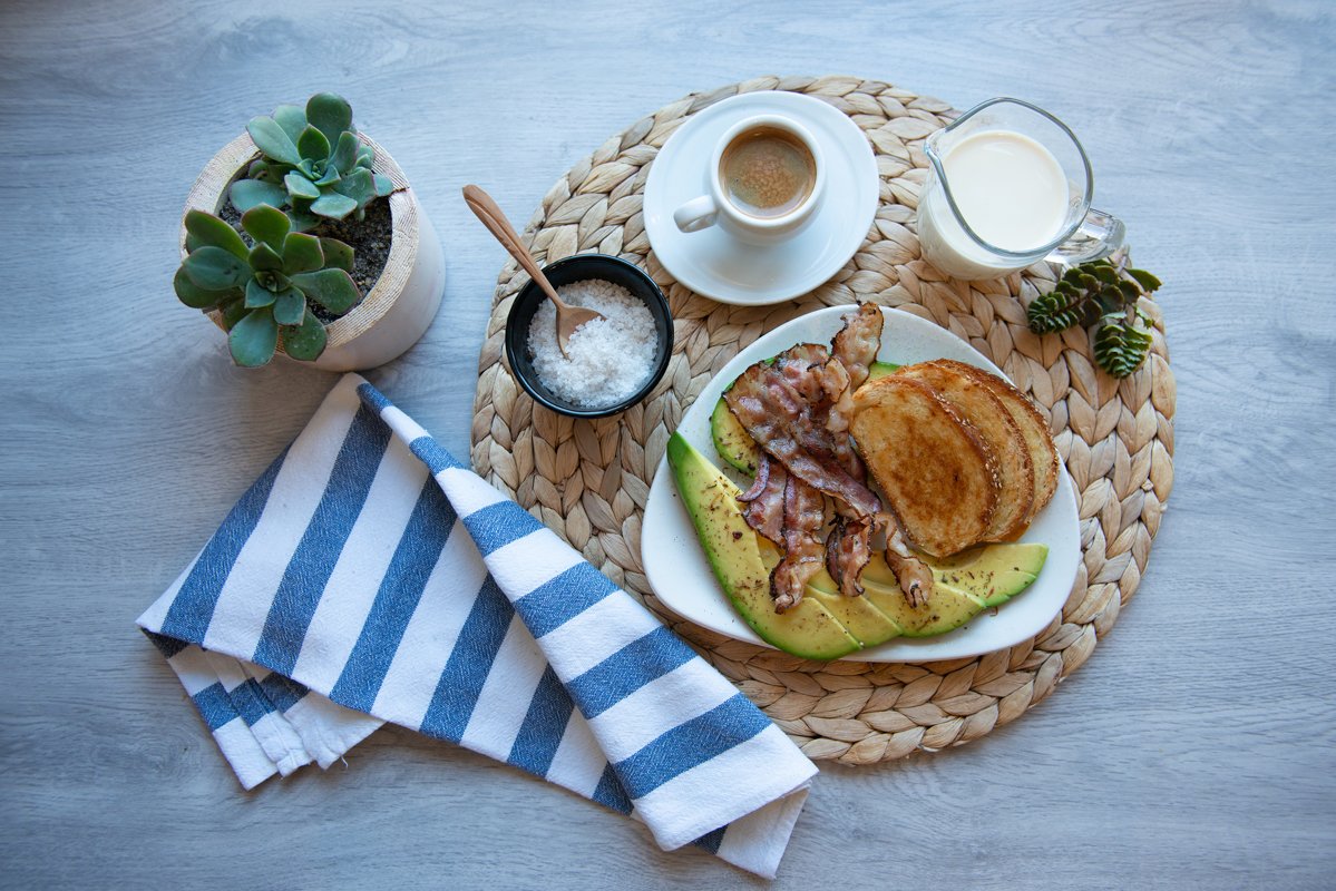 Fried bacon on white plate with cup of coffee and milk jug example image 1