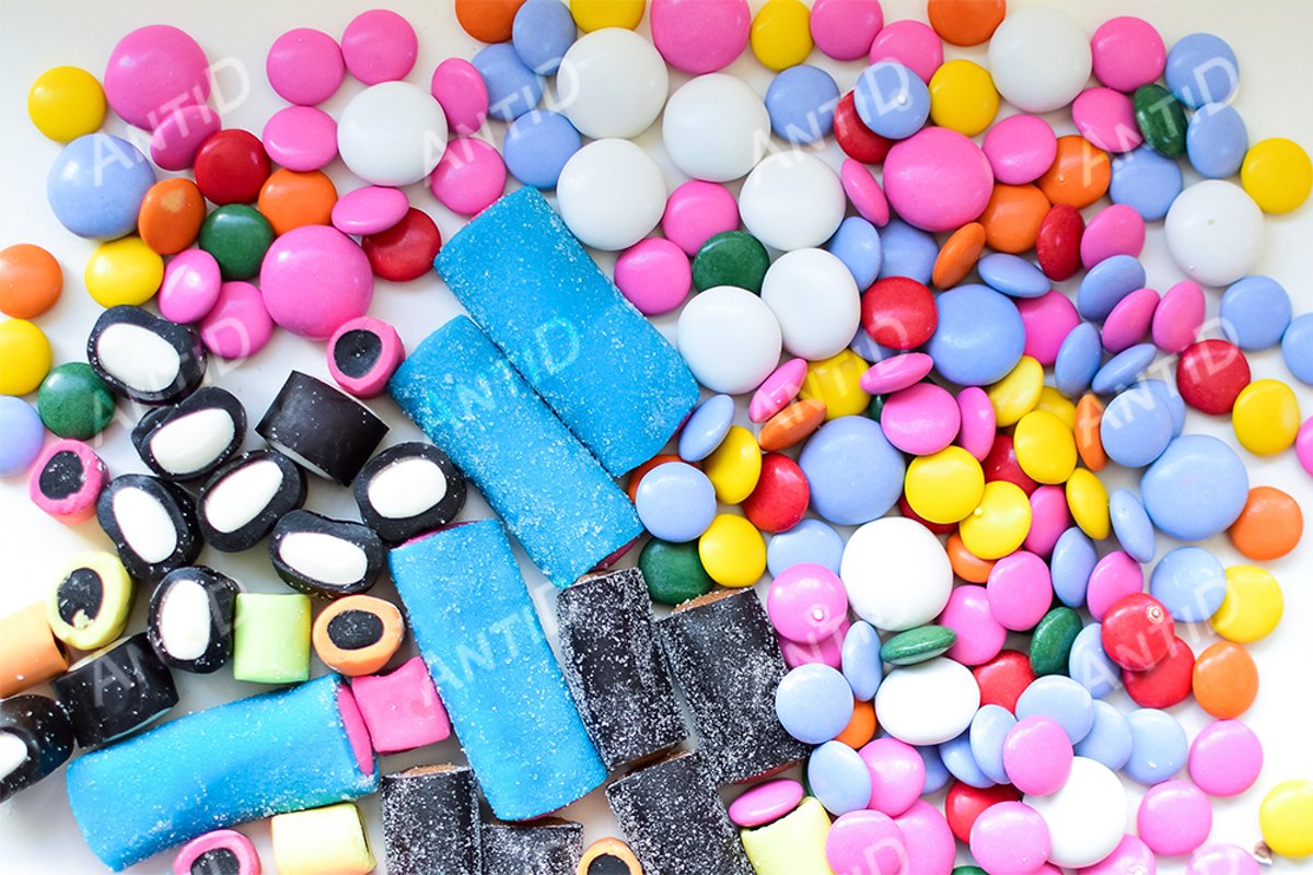 Multicolored candy on a white background. example image 1