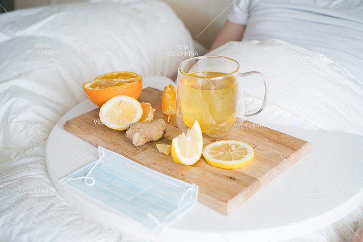 Cup of tea, orange,lemon,ginger. Face mask. Sick man in bed example image 1