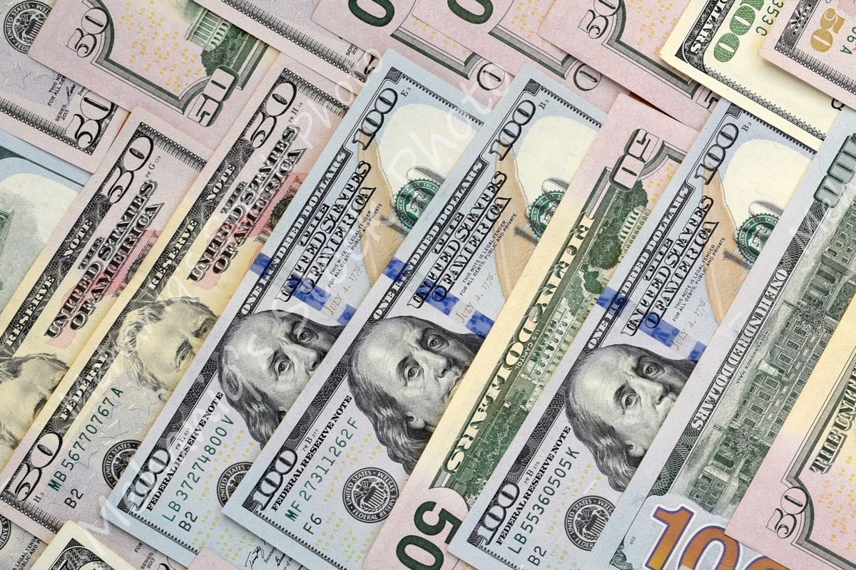 Many american dollar bills close up example image 1