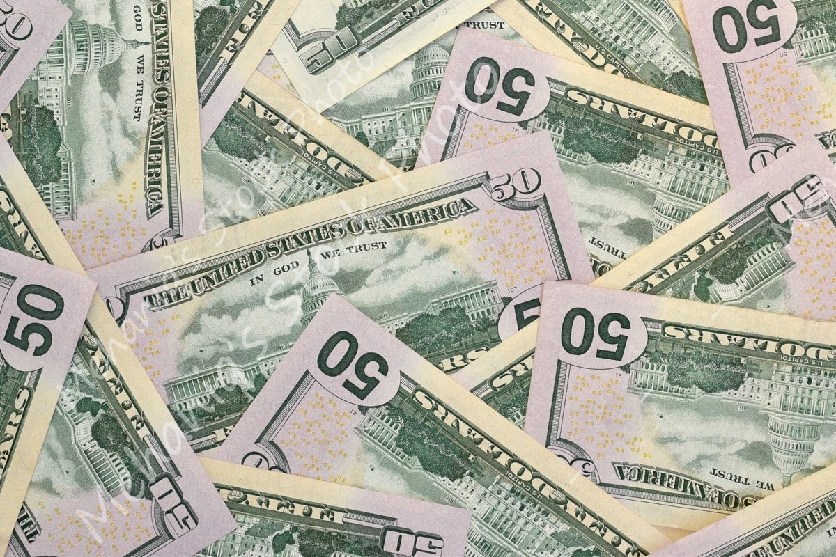 Many american dollar bills close up example image 1