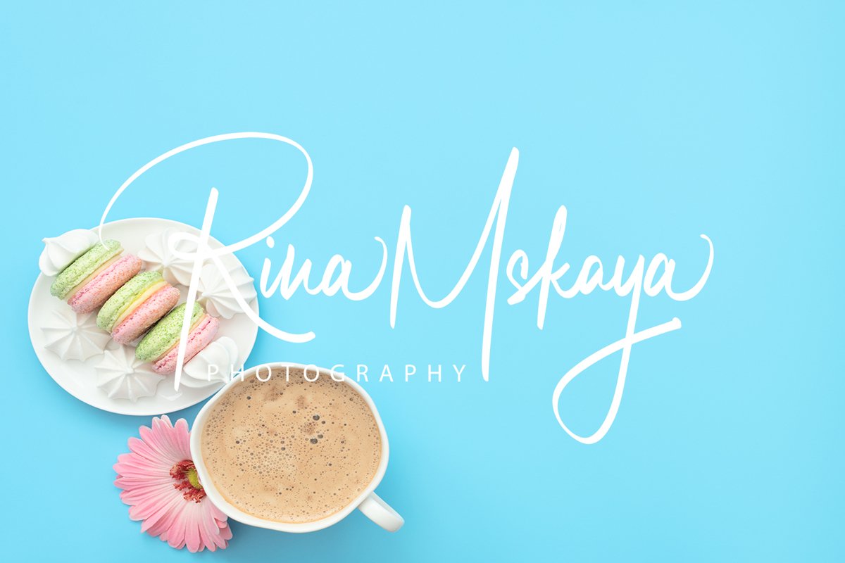 The cup of cappuccino and delicious macarons example image 1
