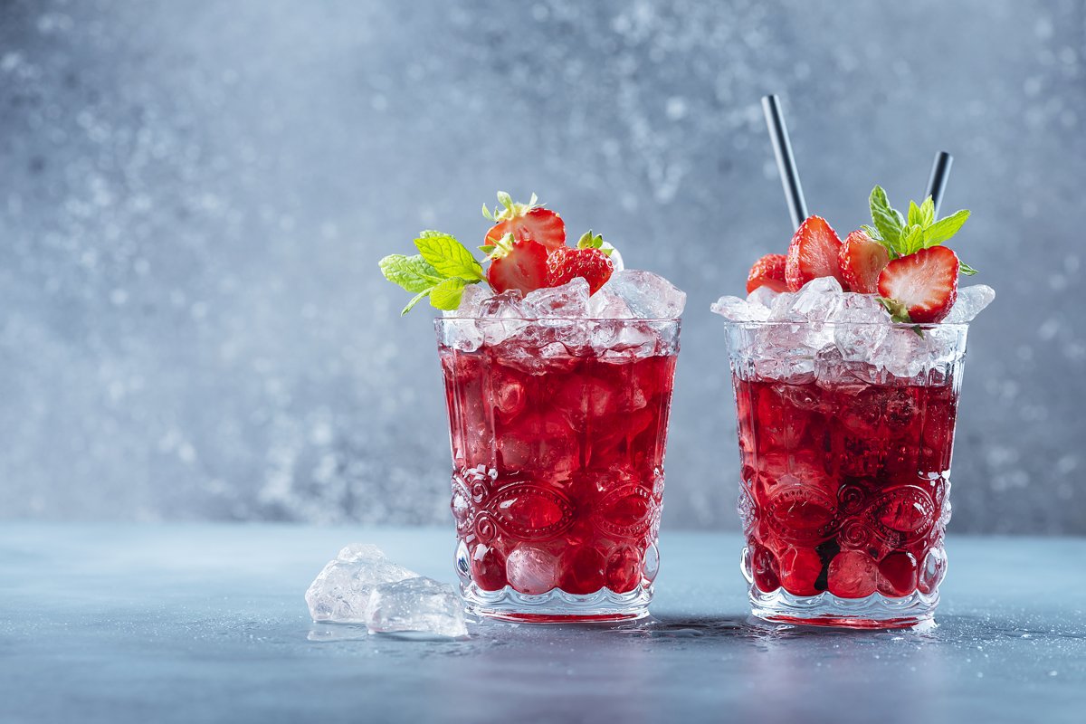 Red cocktail with ice and mint. Bar concept. example image 1