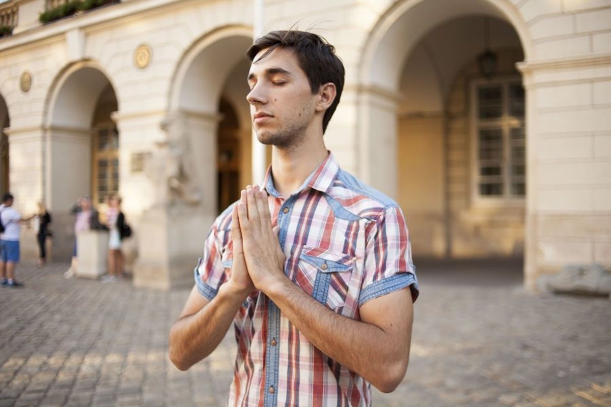 Young man walks in the city example image 1