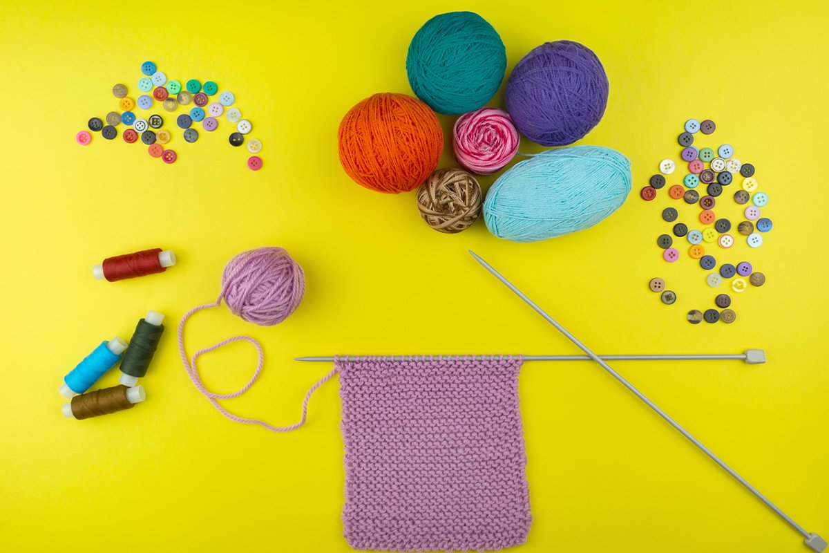 the girl knits a children's scarf on a yellow background example image 1