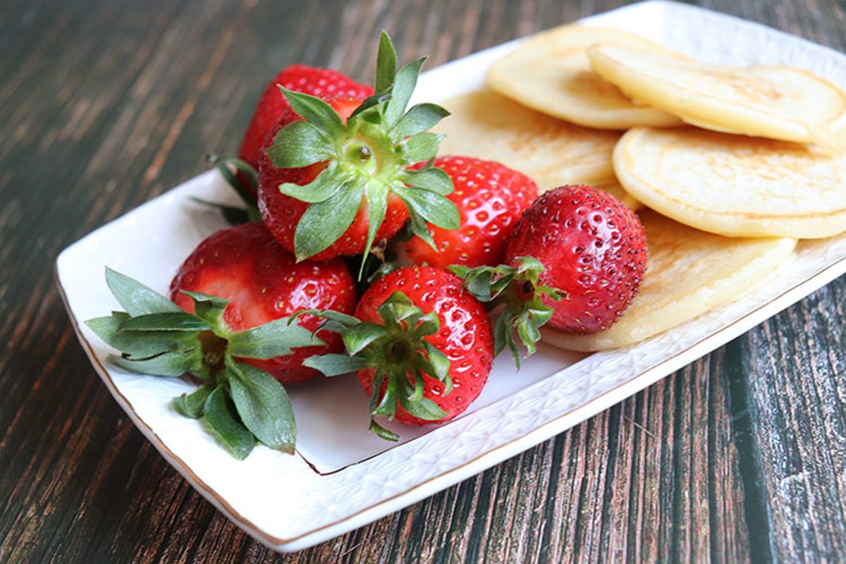Breakfast pancakes and strawberries close-up example image 1
