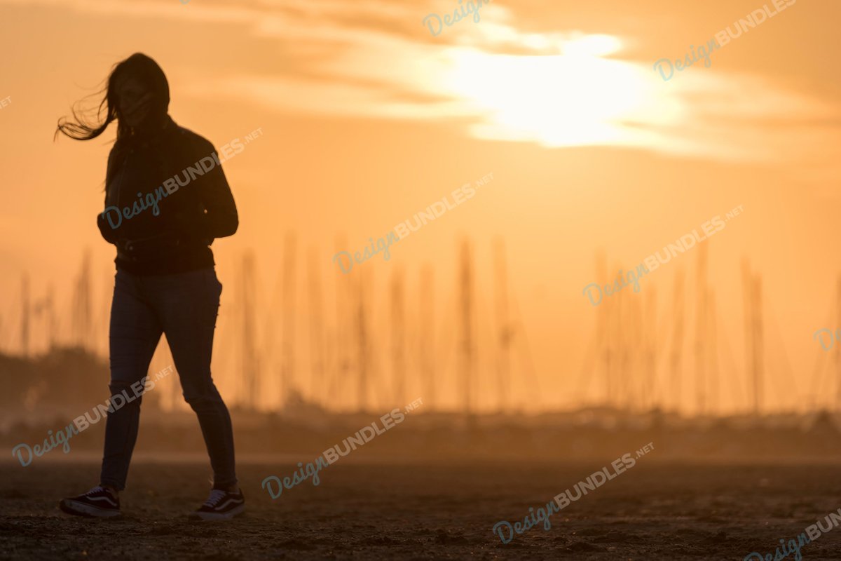 Stock Photo - Young Girl Running at Sunset example image 1