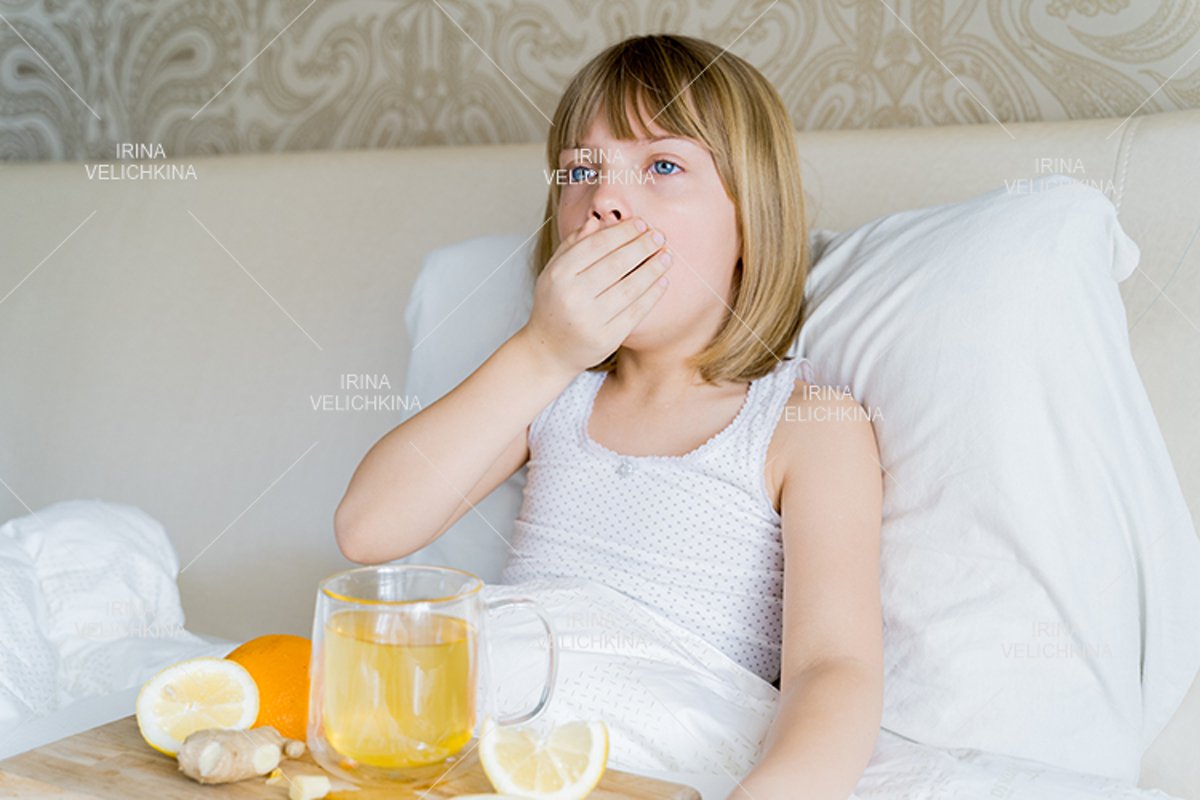 Sick girl in bed. Cup of flu drugs. Tea, orange,lemon,ginger example image 1