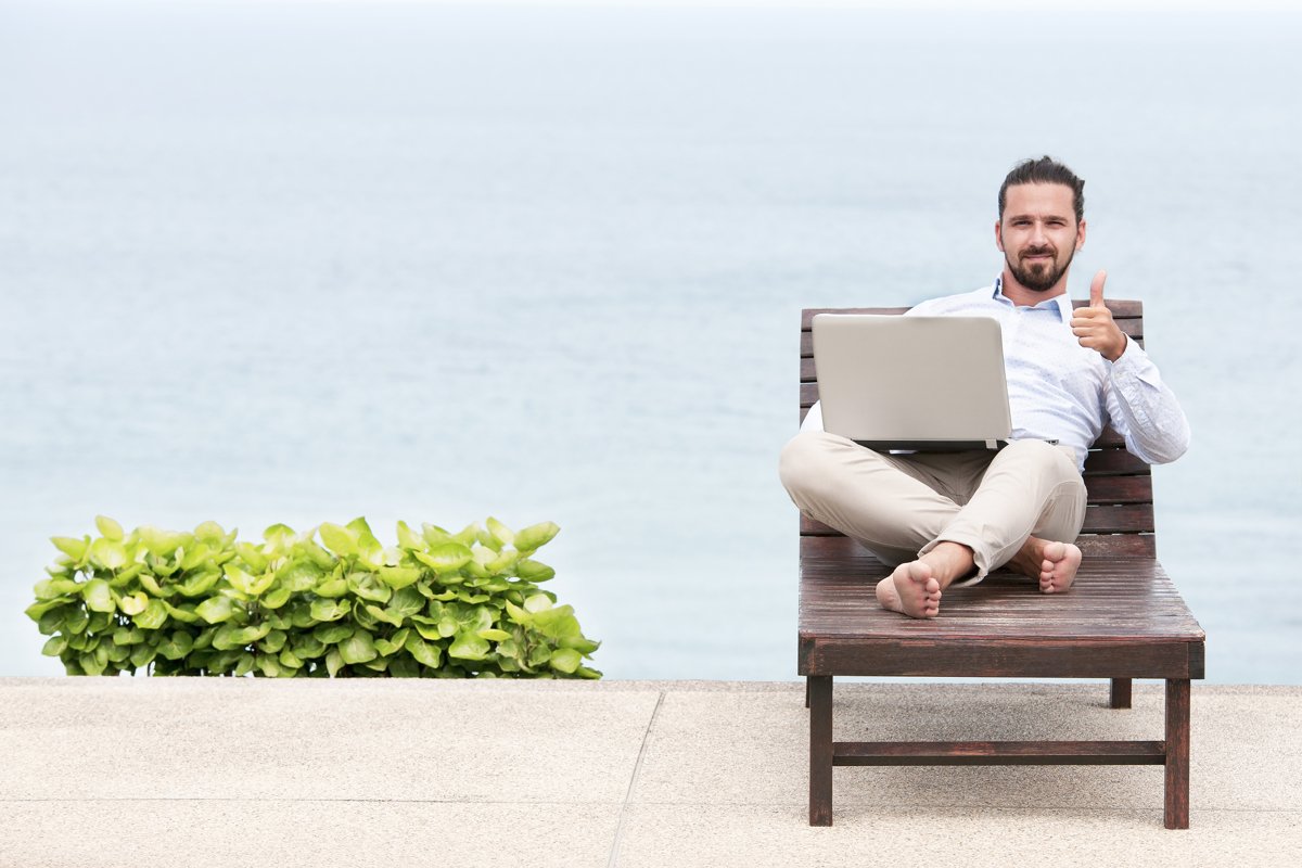Businessman freelance on beach with laptop example image 1