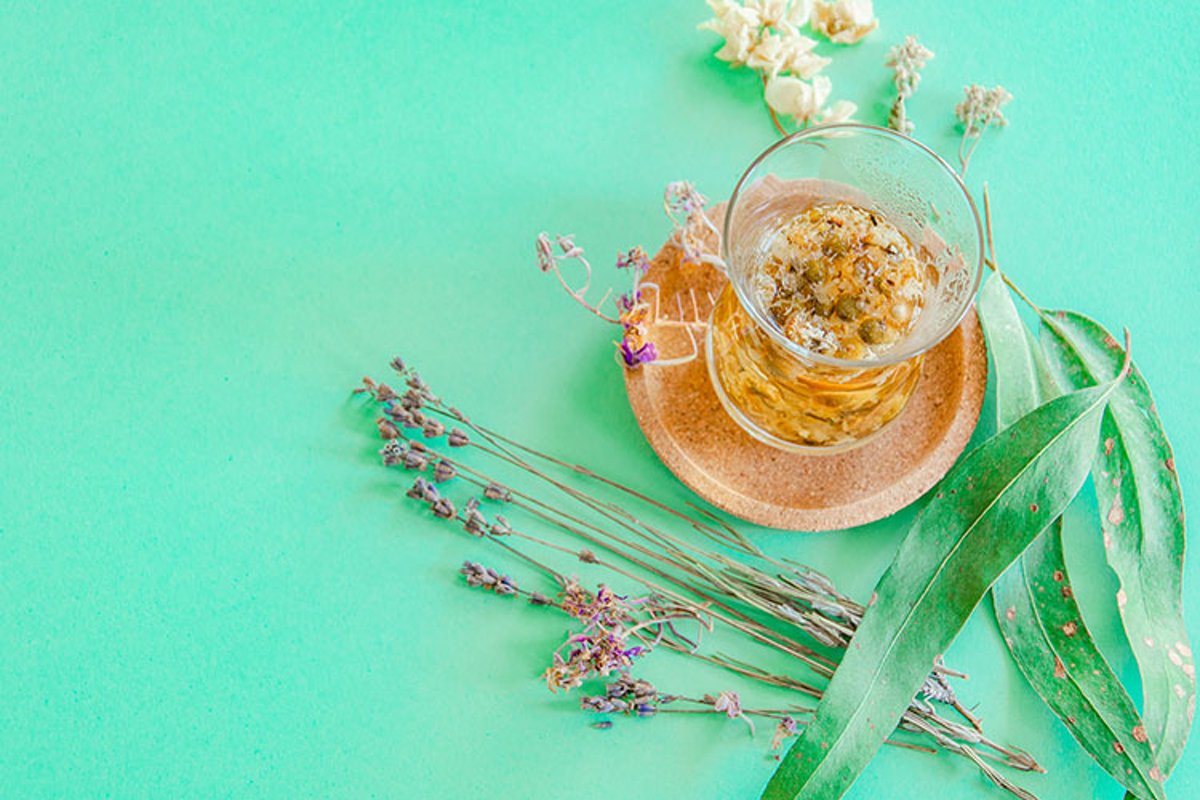 Cup of herbal tea with chamomile flowers. example image 1