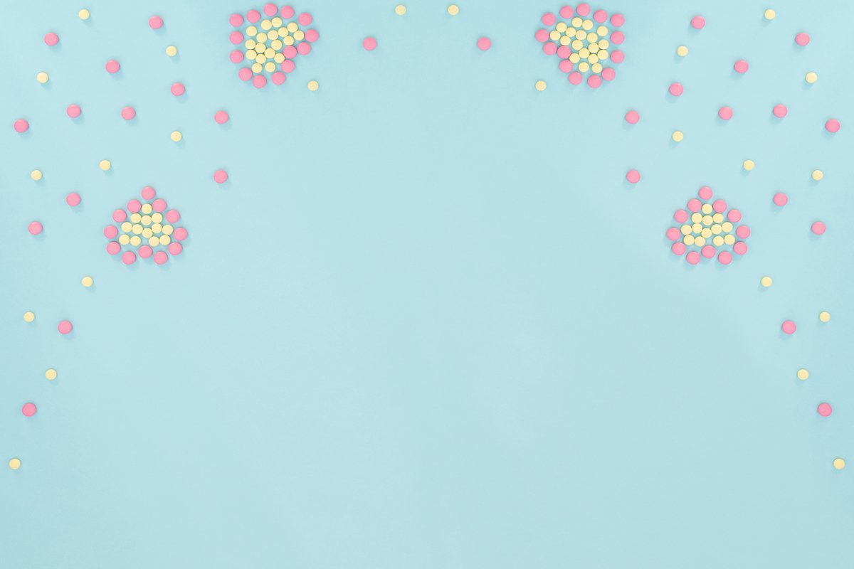 Two hearts made of pink and yellow pills example image 1