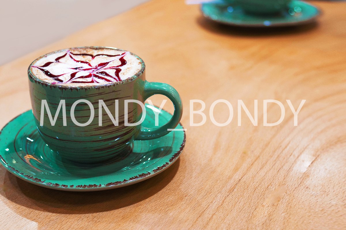 Cup of latte with froth and topping on a wooden background example image 1