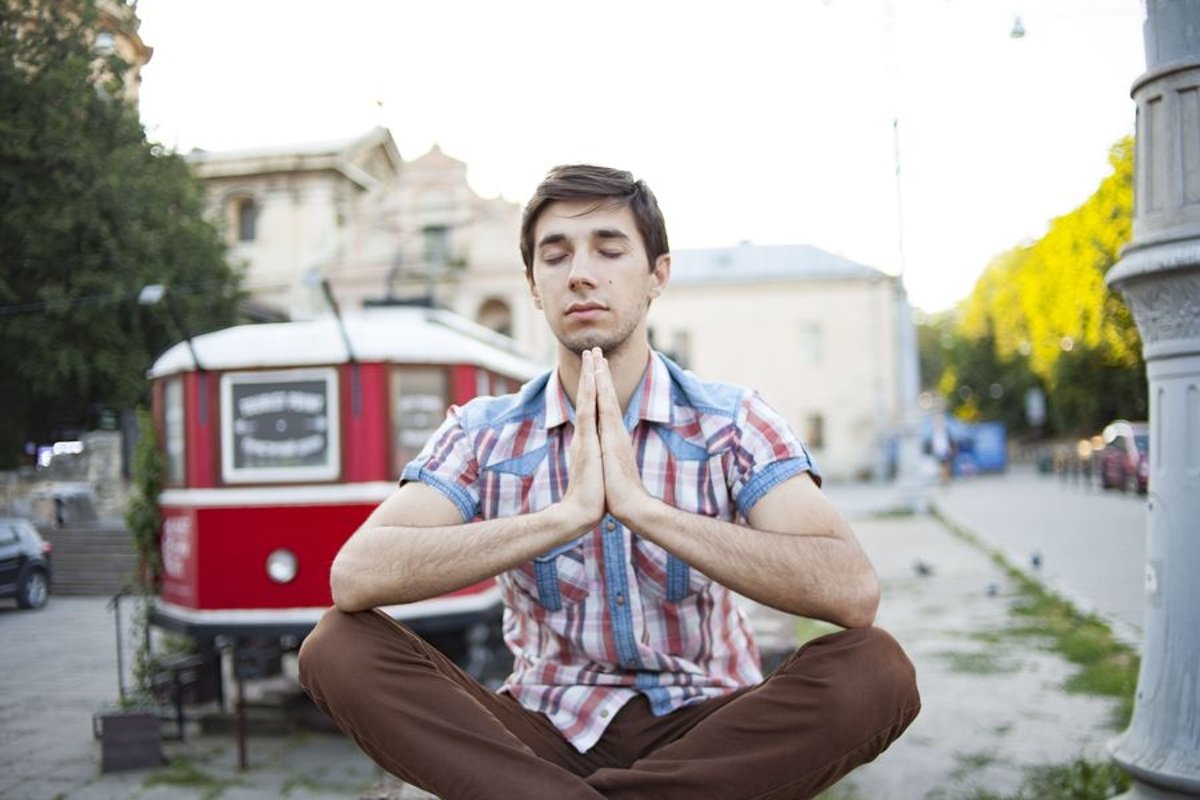 Young man walks in the city example image 1