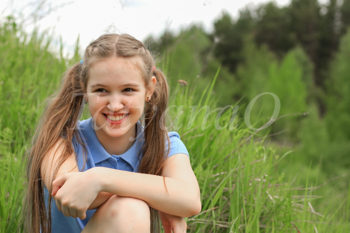A young beautiful girl, a teenager walking in the Park example image 1