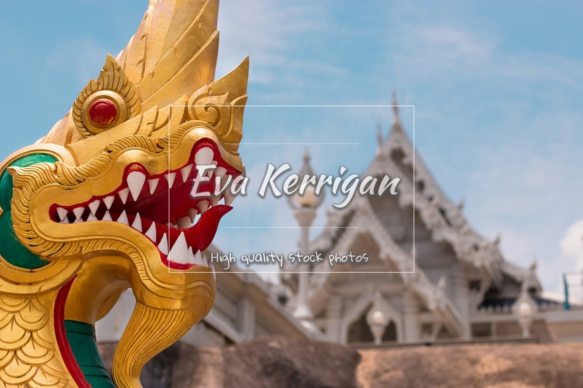 Head of a golden dragon against temple Wat Kaew Korawaram. example image 1