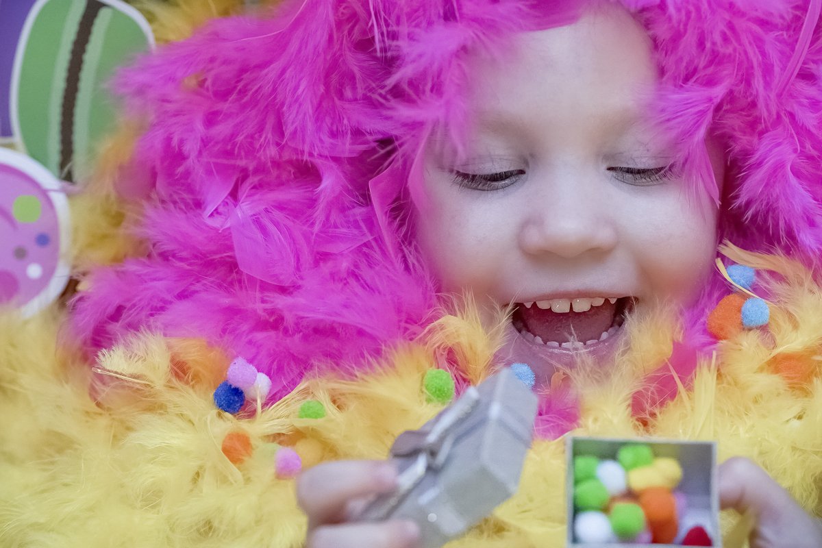 Emotional girl lies in a blurred festive setting. Birthday example image 1
