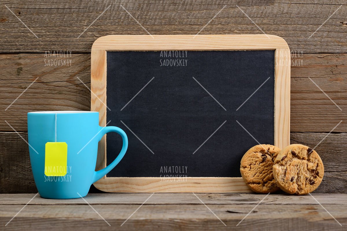 Cup of tea with cookies and small blackboard example image 1