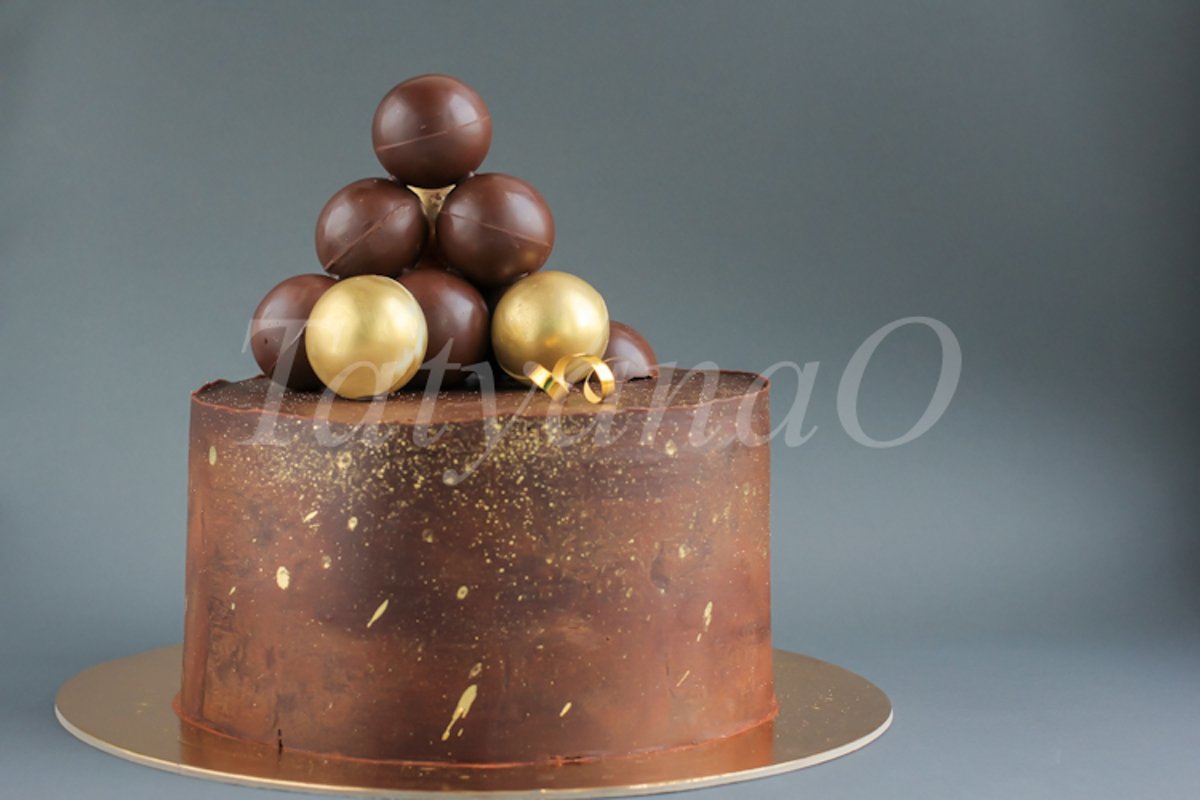 Chocolate birthday cake with gold decorations. example image 1