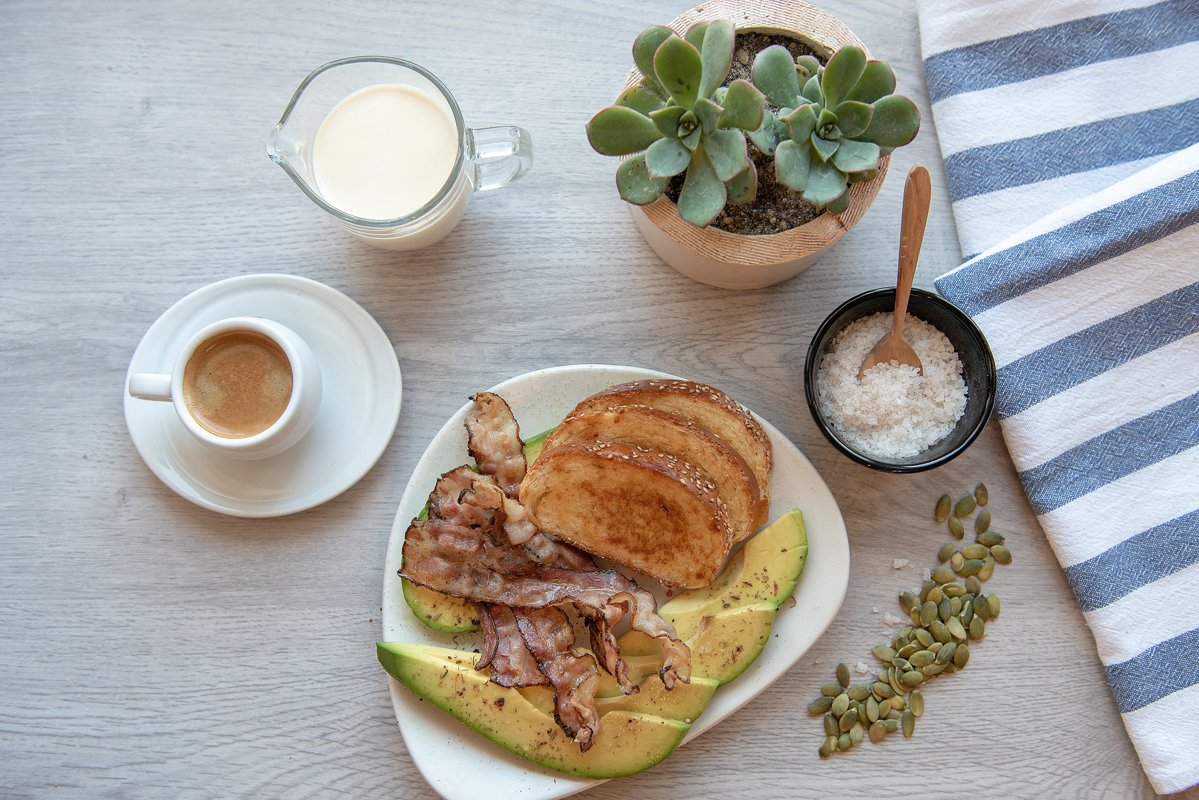 Fried bacon on white plate with cup of coffee and milk jug example image 1