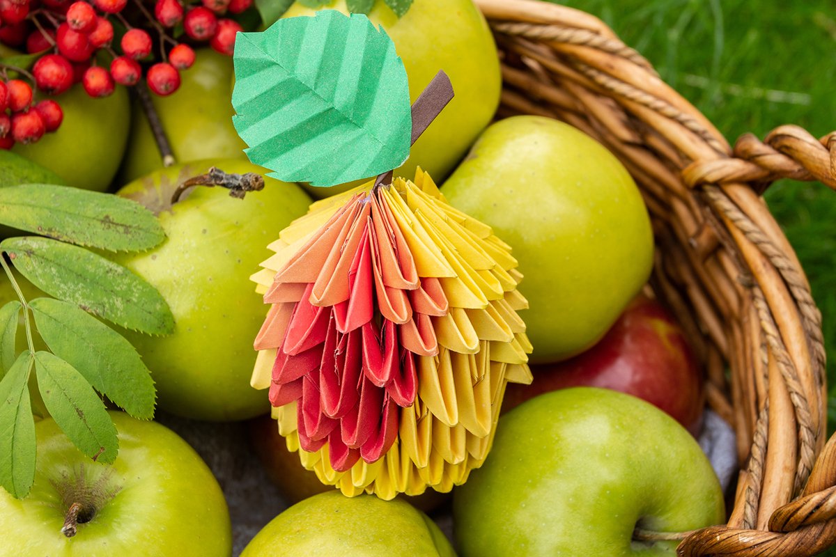 Autumn Apple harvest background wicker basket on green grass example image 1