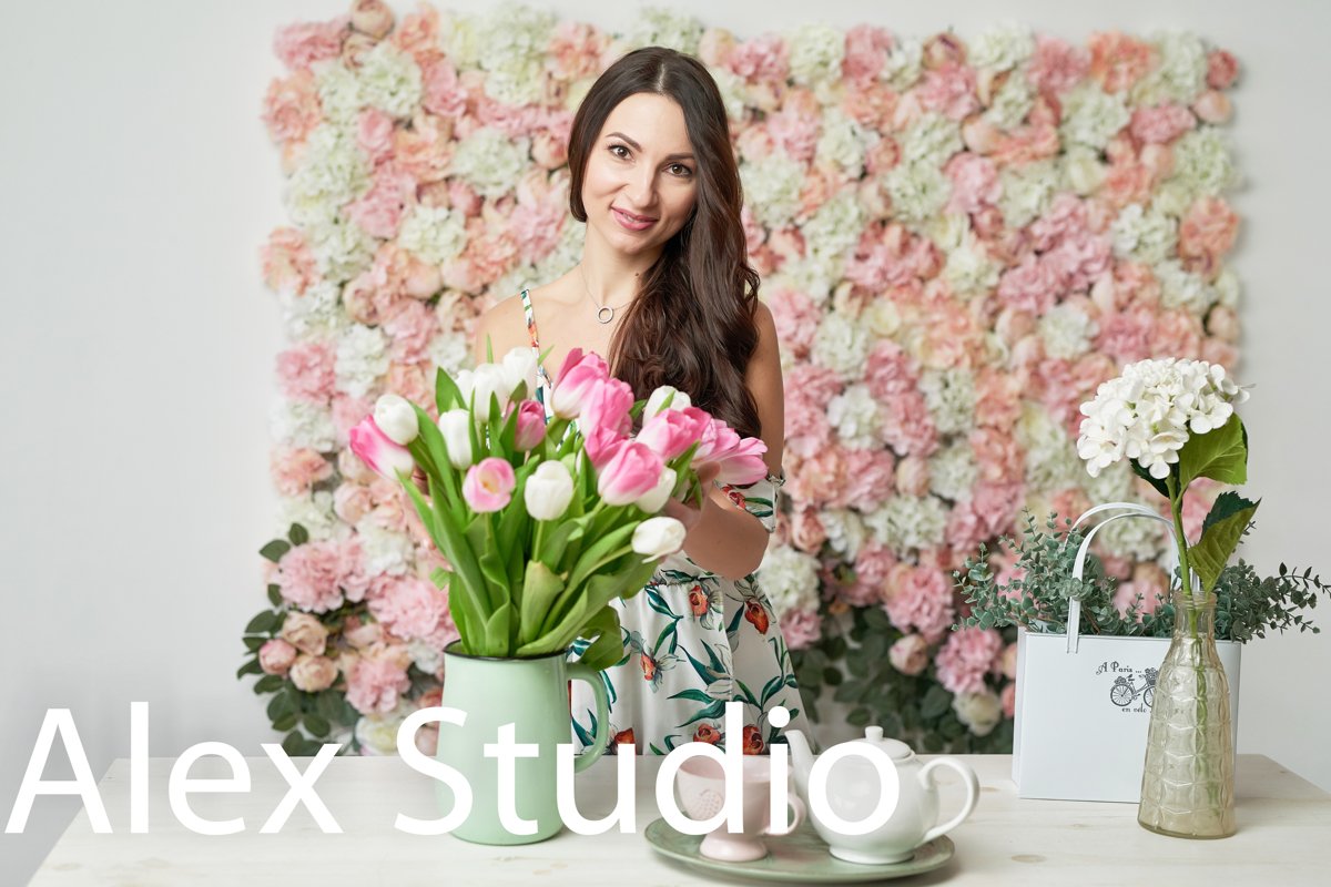 Beautiful girl with tulip flowers in hands on floral backgro example image 1