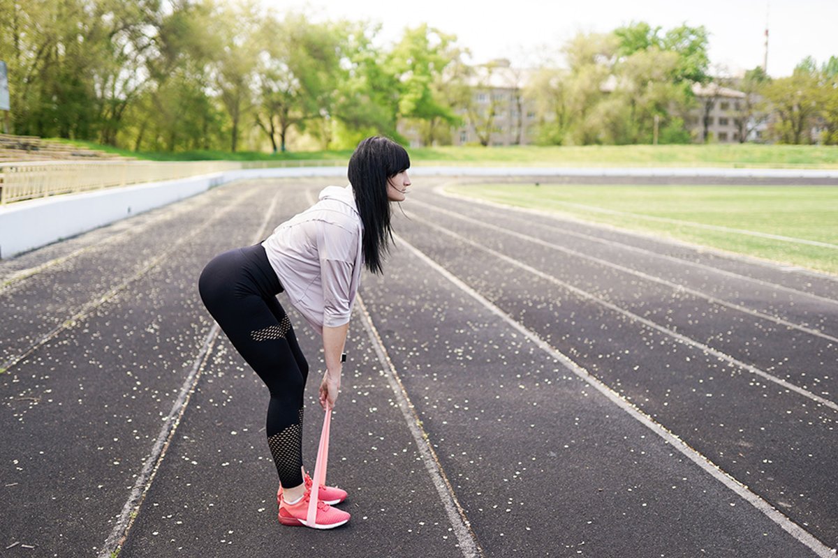 sport and lifestyle concept - woman doing sports outdoors. example image 1