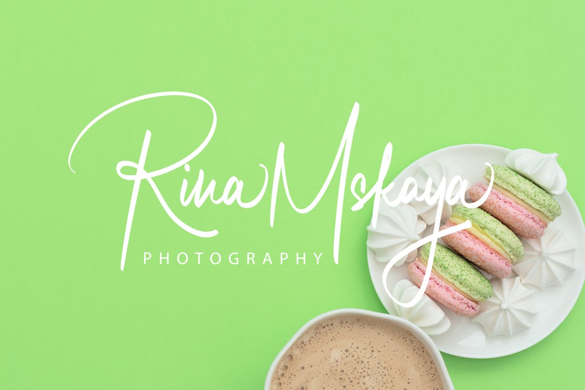 The cup of cappuccino and delicious macarons example image 1