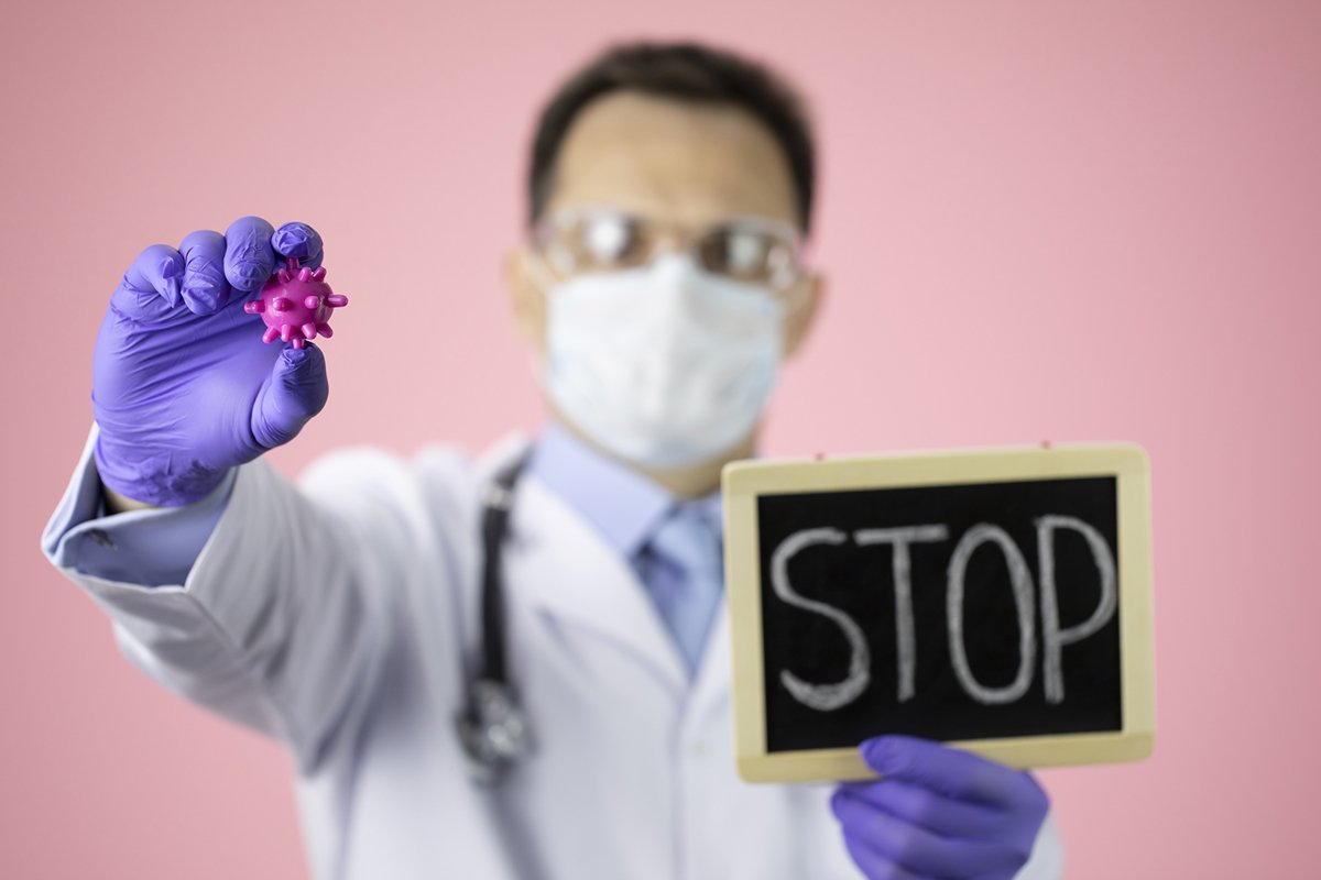 Doctor therapist with a stethoscope on a pink background example image 1