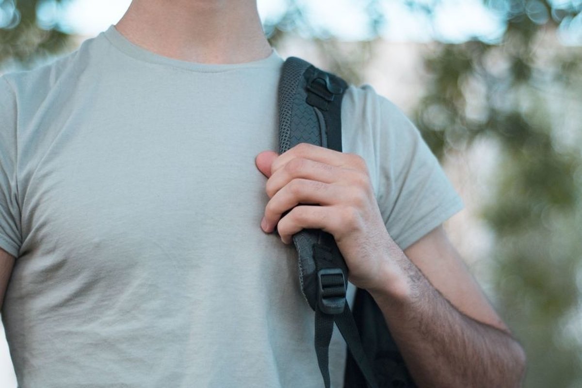 Young caucasian man walks in a park example image 1