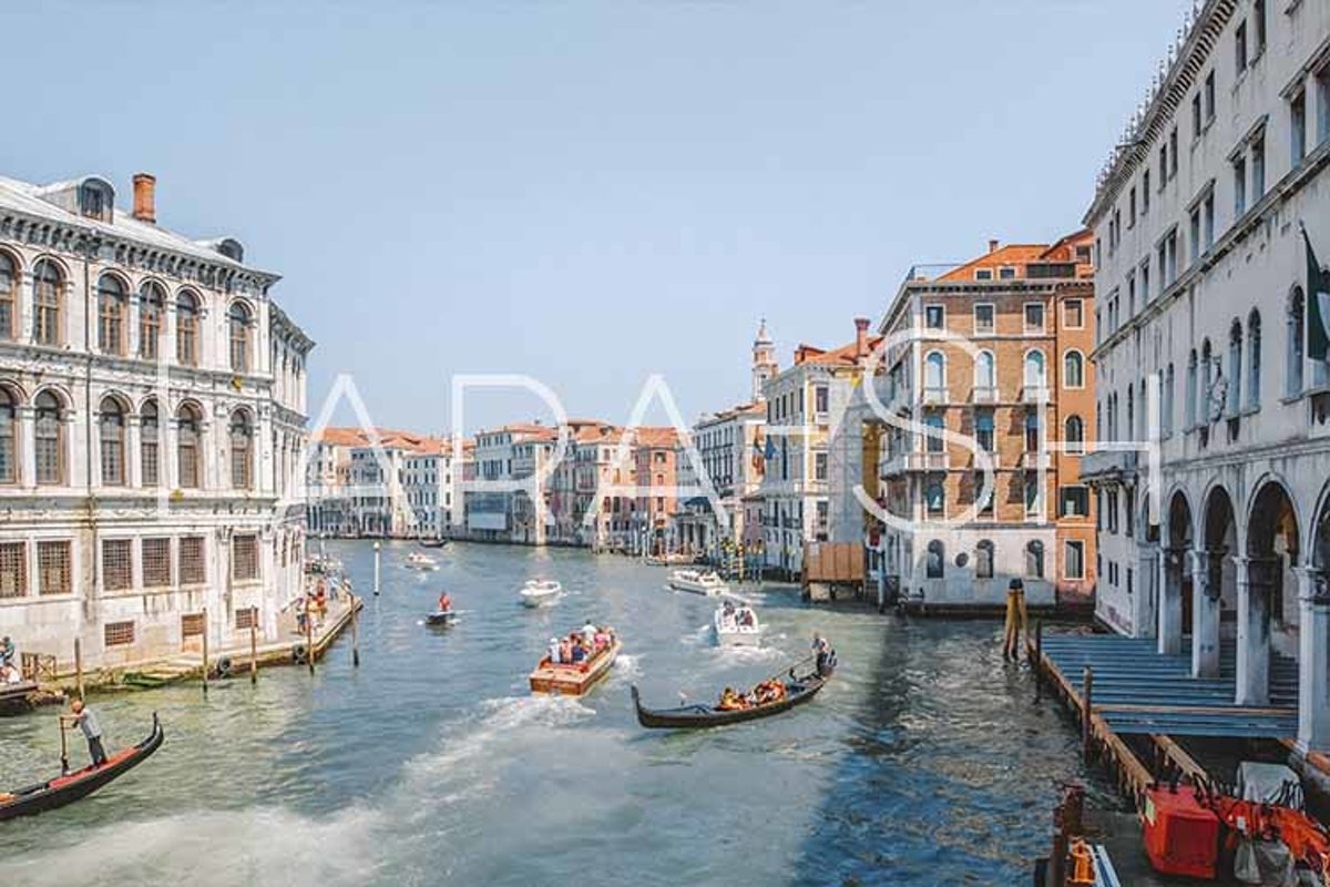 Gondolas on narrow canal in Venice, Italy. example image 1