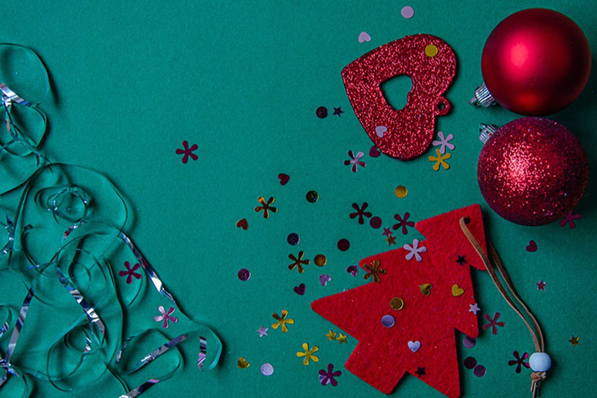 Red Christmas tree, beads, balls on a green background. example image 1