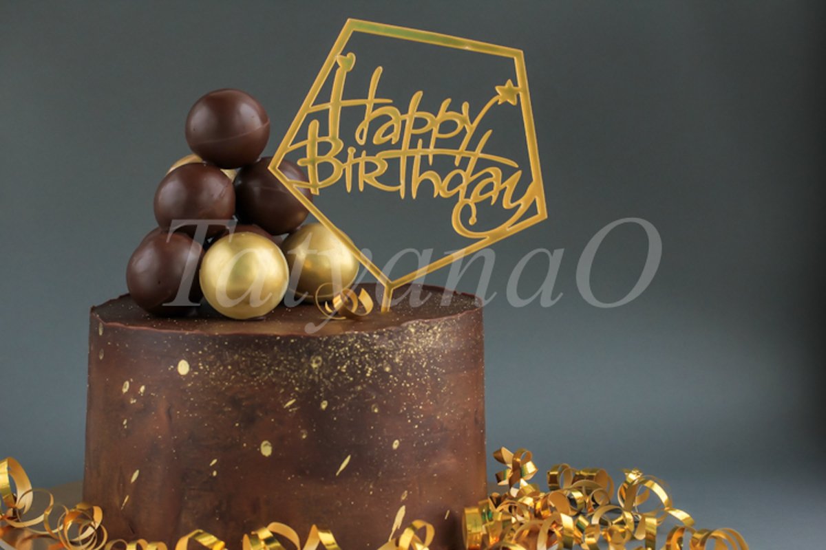 Chocolate birthday cake with gold decorations. example image 1