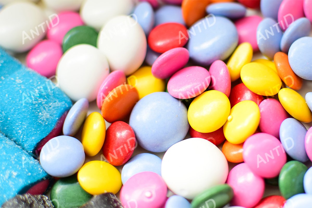 Multicolored candy on a white background. example image 1