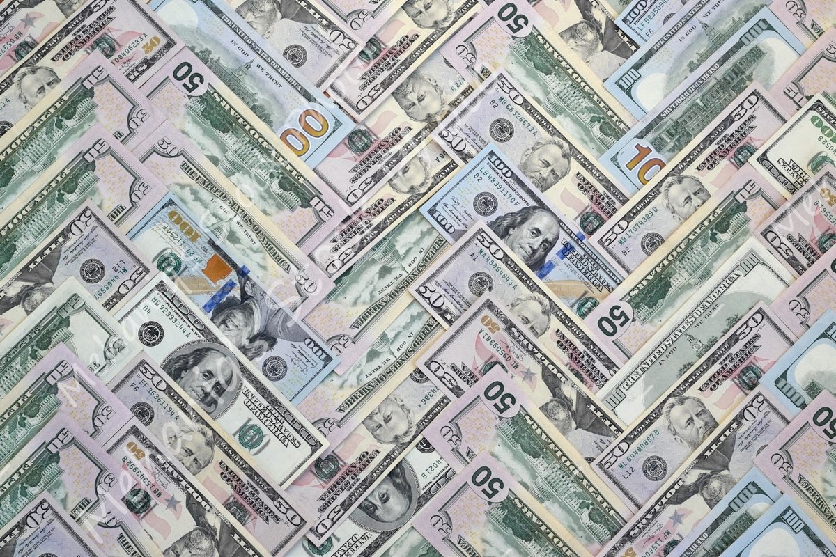Many american dollar bills close up example image 1