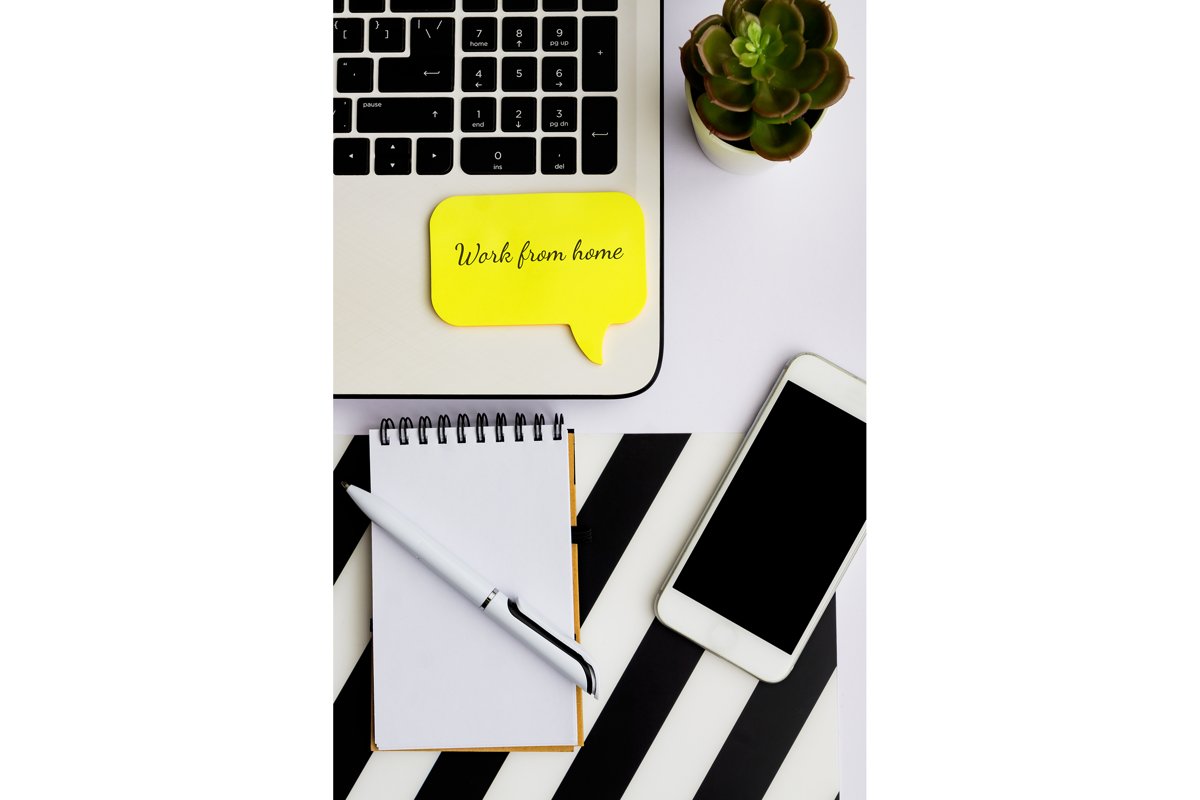home office with laptop, smartphone and notepad with pen example image 1