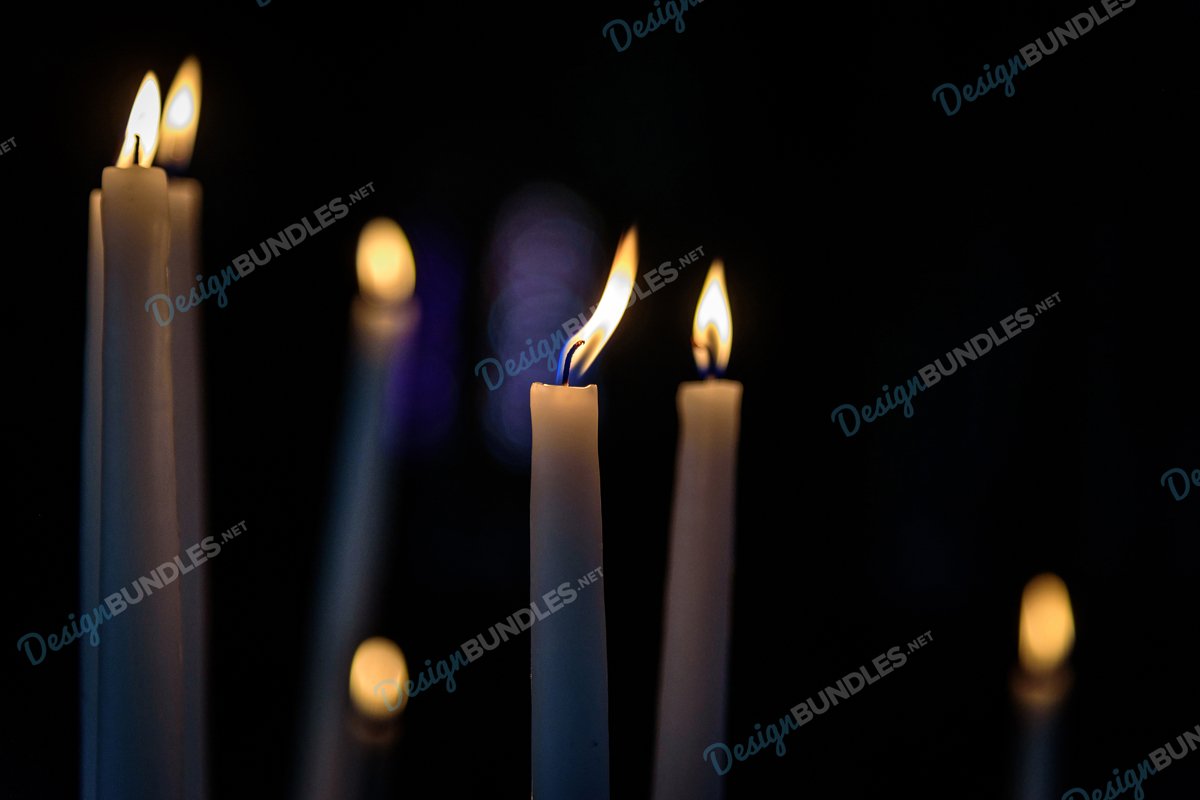 Stock Photo - Close-Up Of Illuminated Candles In Darkroom example image 1
