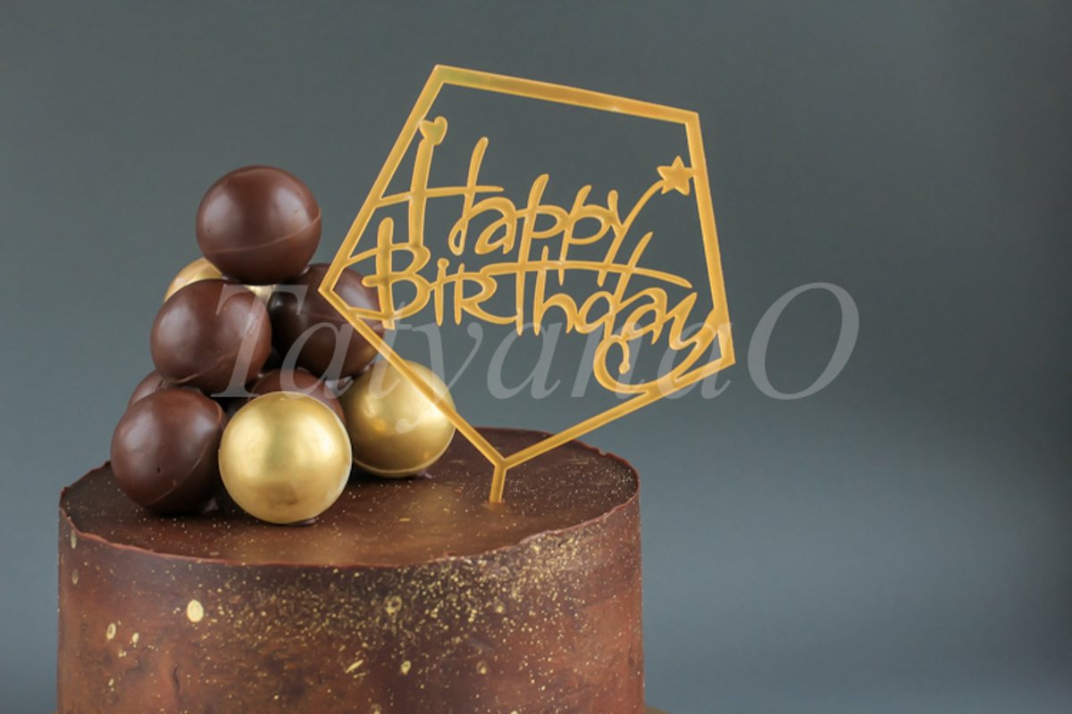 Chocolate birthday cake with gold decorations. example image 1