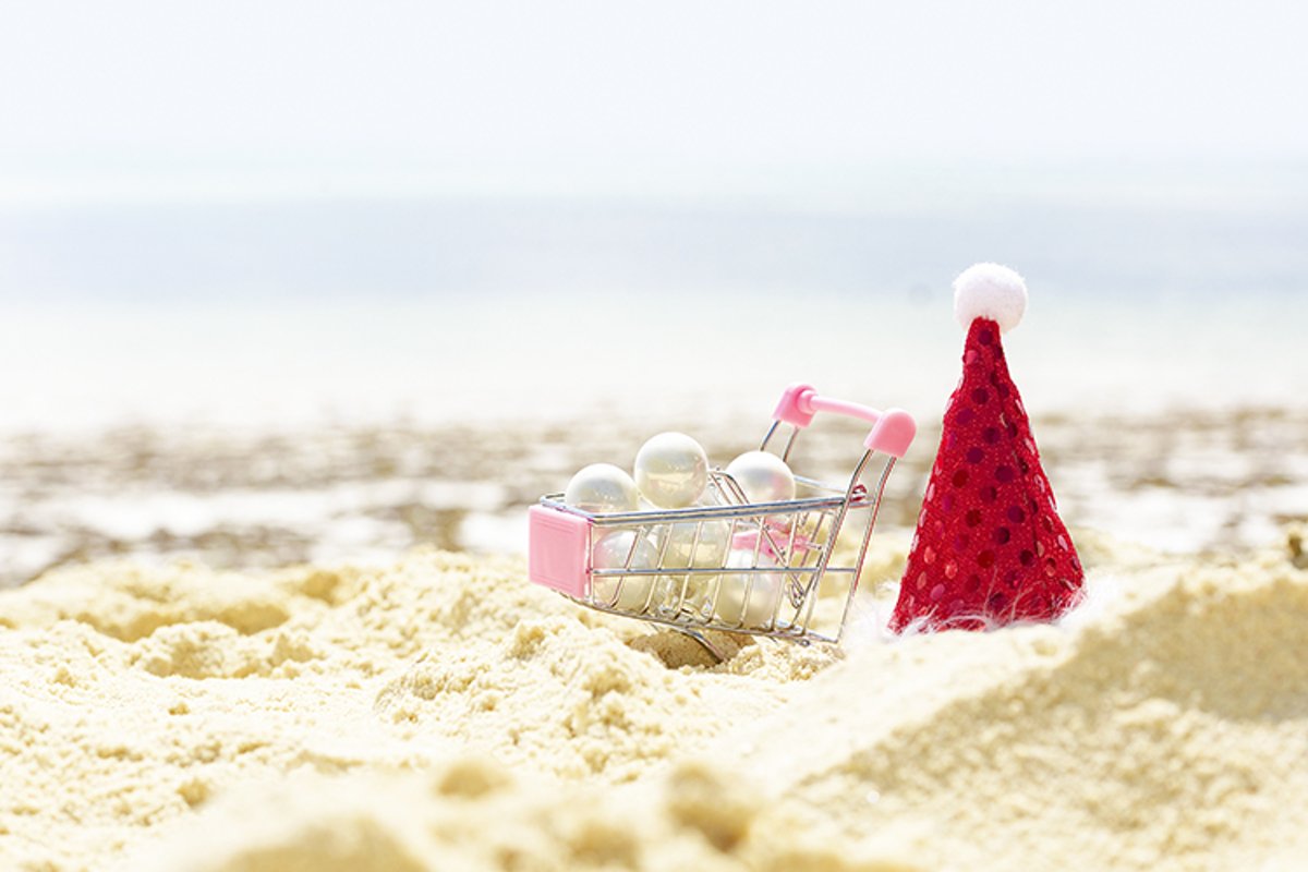 cart with Christmas balls and Santa's hat example image 1