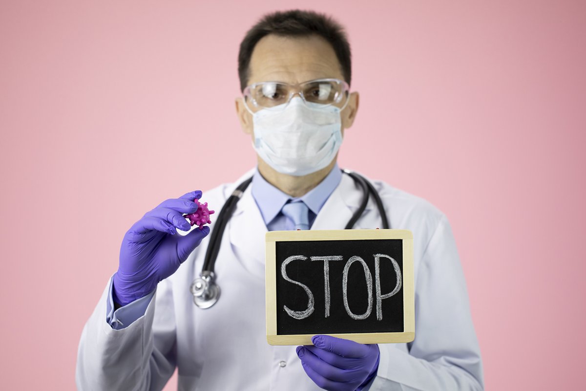 Doctor therapist with a stethoscope on a pink background example image 1