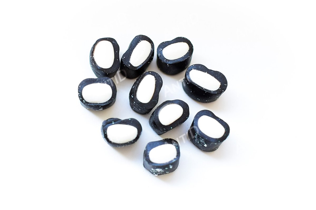 Multicolored licorice candy on a white background. example image 1