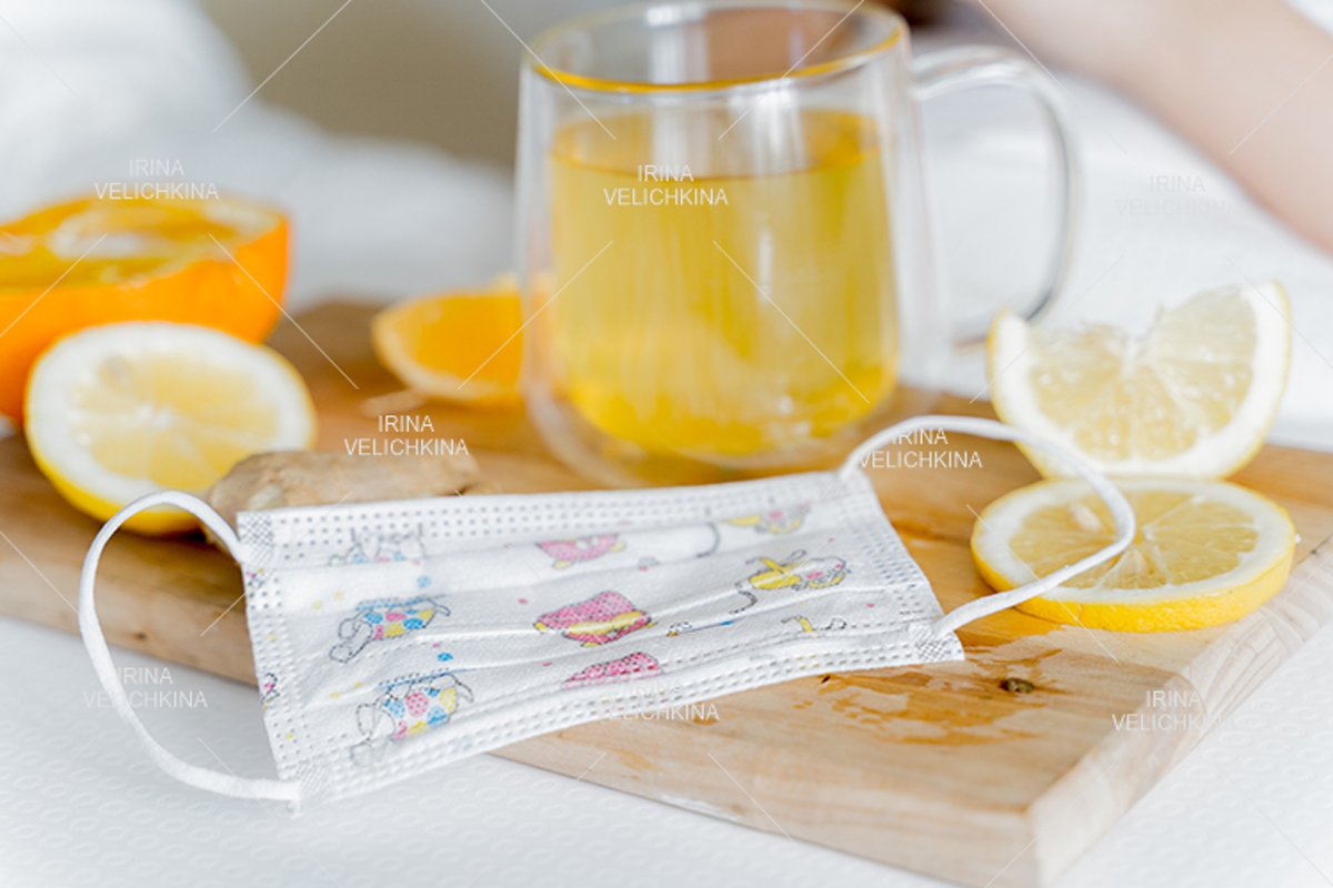 Cup of flu drugs, kids face mask. Tea, orange,lemon,ginger example image 1