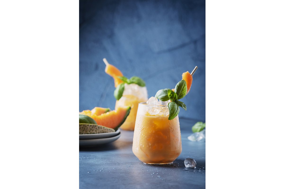 Bar concept. Sweet summer liquor with melon, ice and basil example image 1