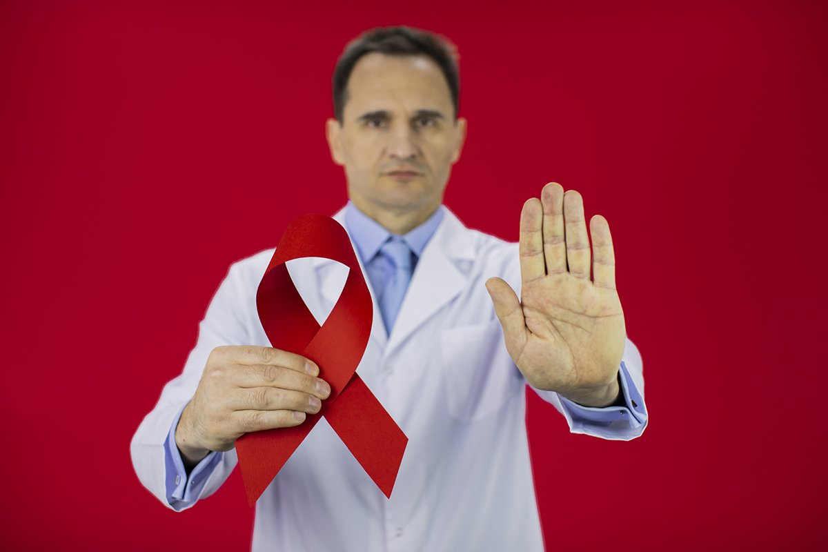 Doctor therapist with a stethoscope on a red background example image 1