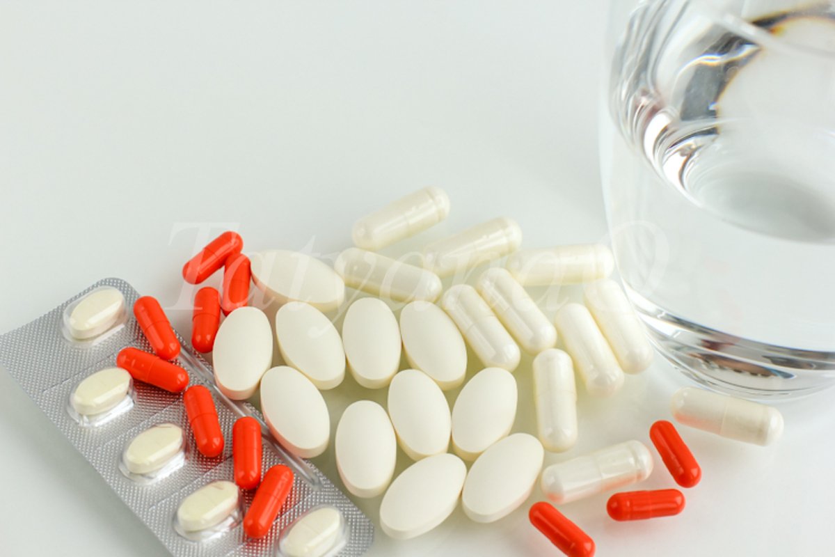 Multicolored pills, tablets against the virus, flu, disease example image 1