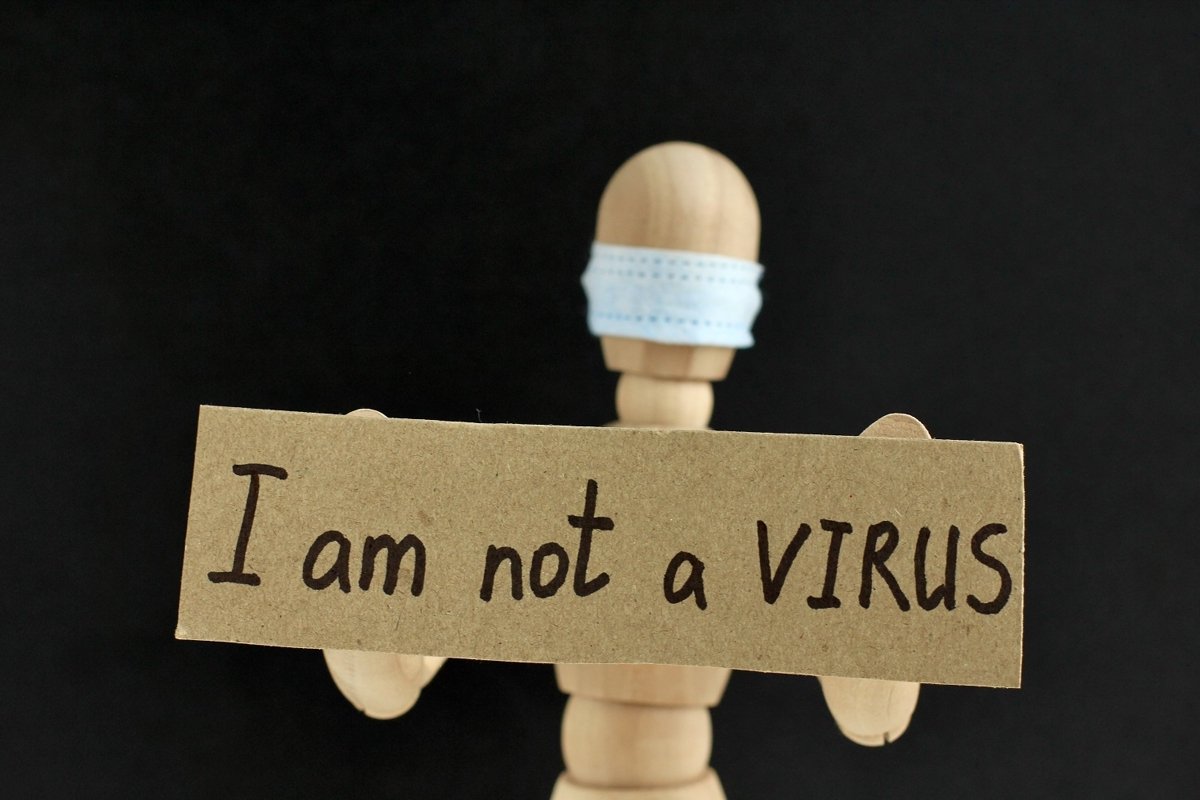 Cardboard sign with text I am not a virus example image 1
