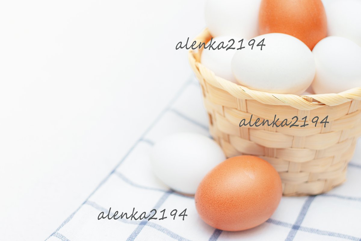 Chicken eggs in a basket on a kitchen towel example image 1
