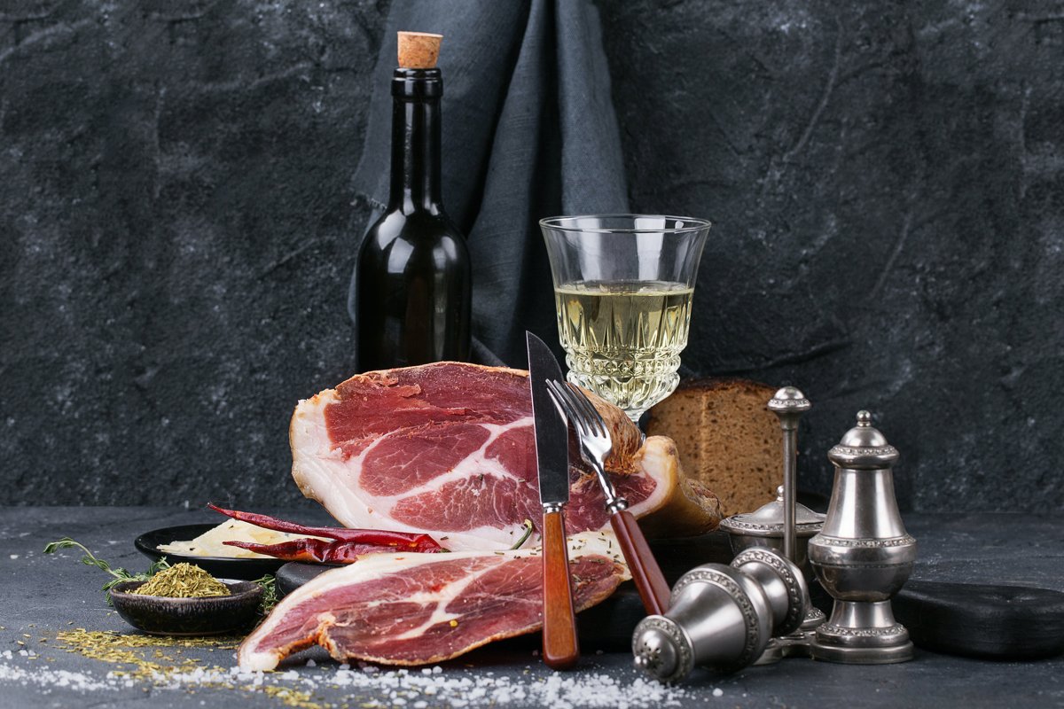 Prosciutto Ham served on a rustic wooden board example image 1
