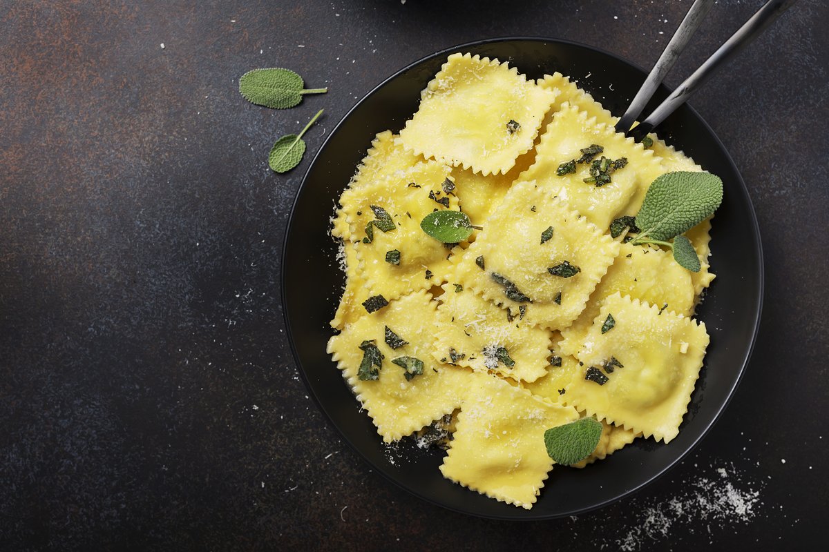 Top down view of a traditional Italian ravioli with butter example image 1